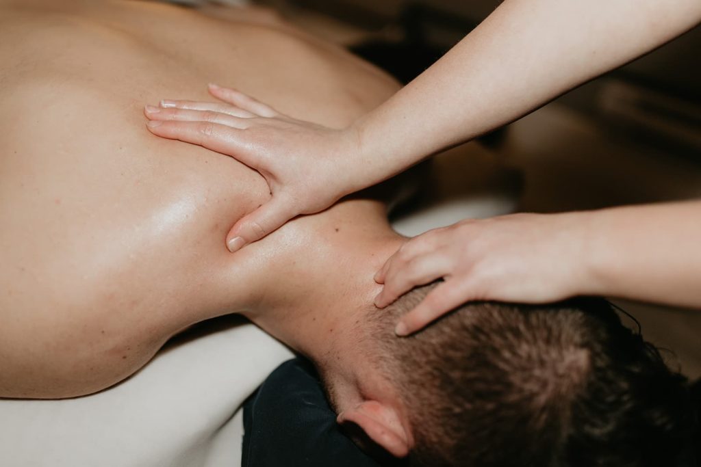 A patient getting a massage from Recovery Lab in Red Deer.