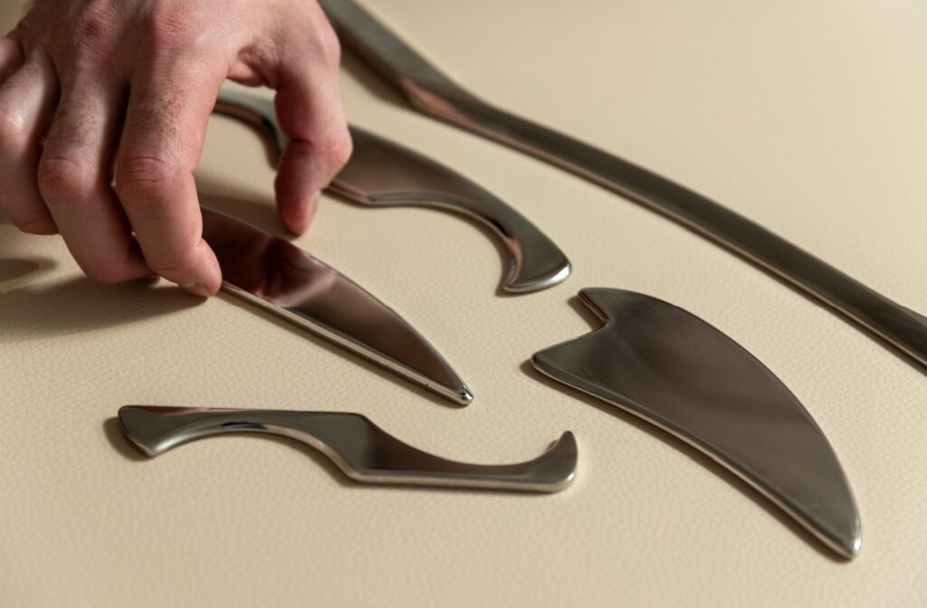 A close-up image of various Graston Technique massage tools.