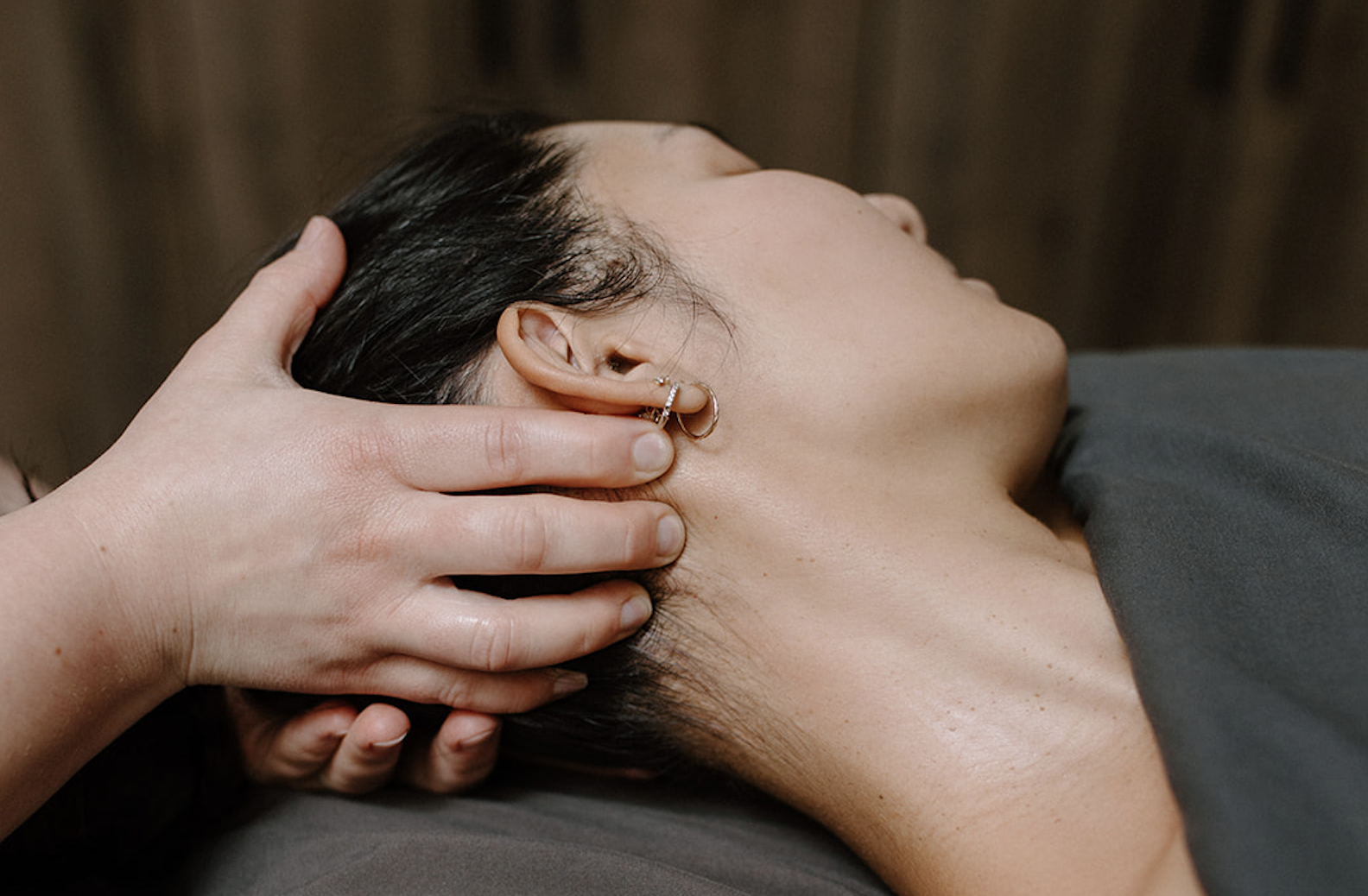 person getting head massage